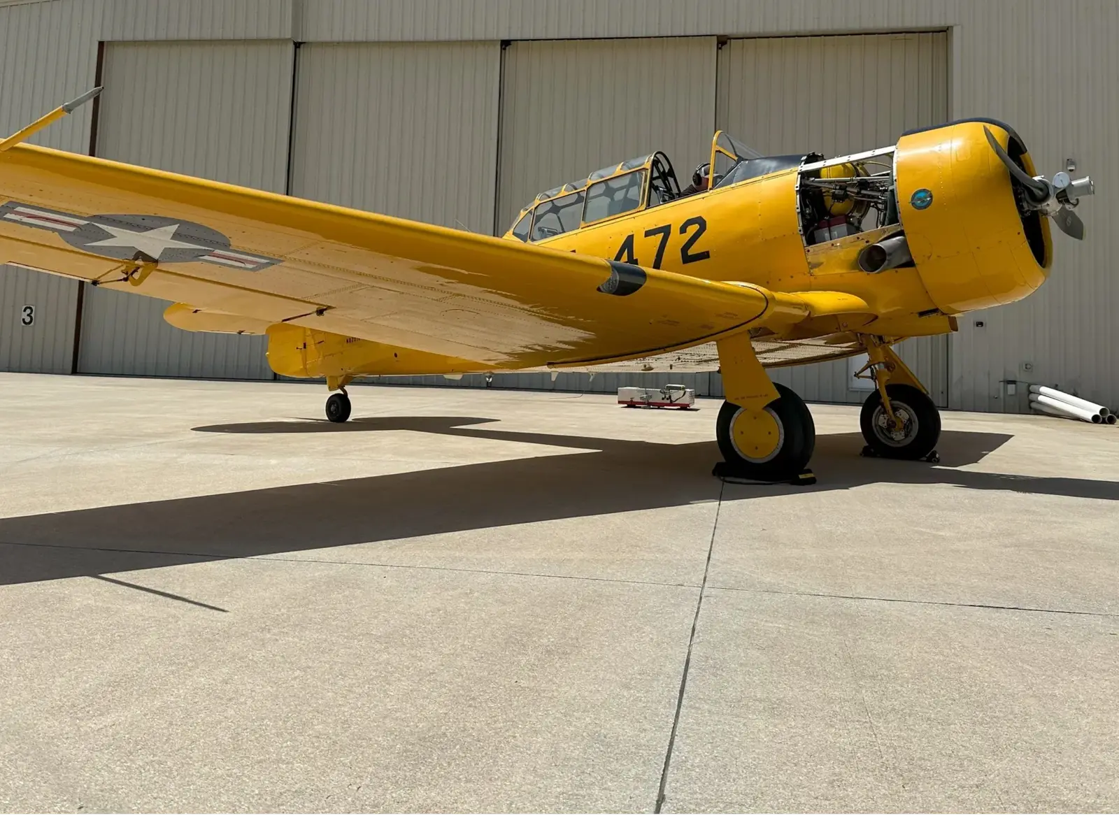 T-6 Texan warbird in the Alpha Company Aviation Florida Gulf Coast hangar, warbird-grade aircraft maintenance